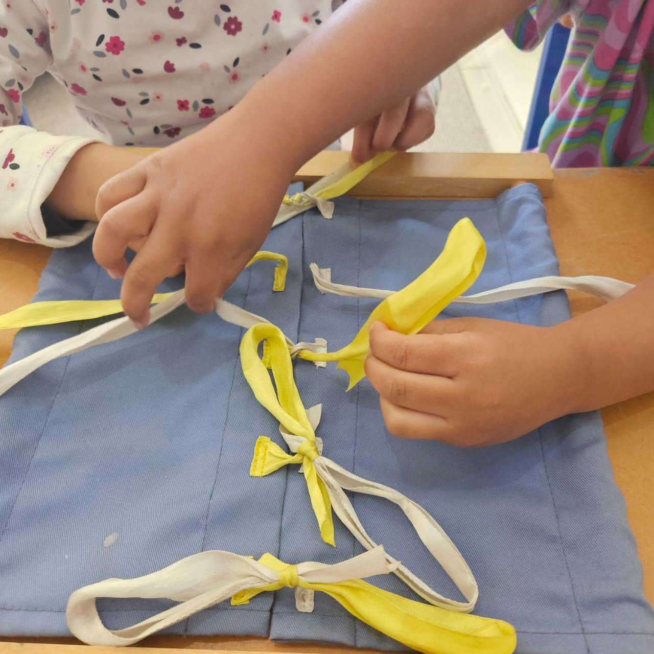 Tying a bow on the bow frame